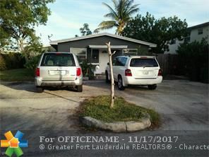 Property Photo:  1619 NE 3rd Ave  FL 33444 