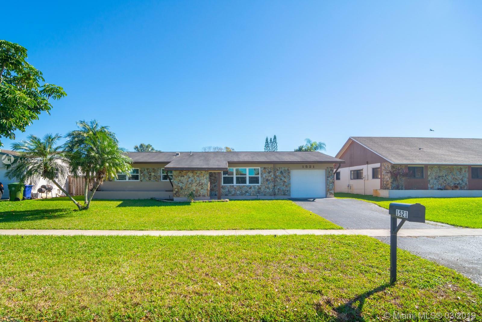 Property Photo:  1521 NW 122nd Ave  FL 33026 