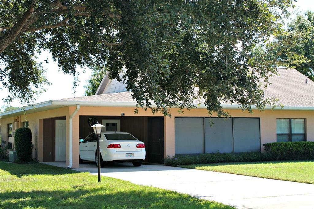 Property Photo:  302 Genesis Pointe Drive 11-2  FL 33859 
