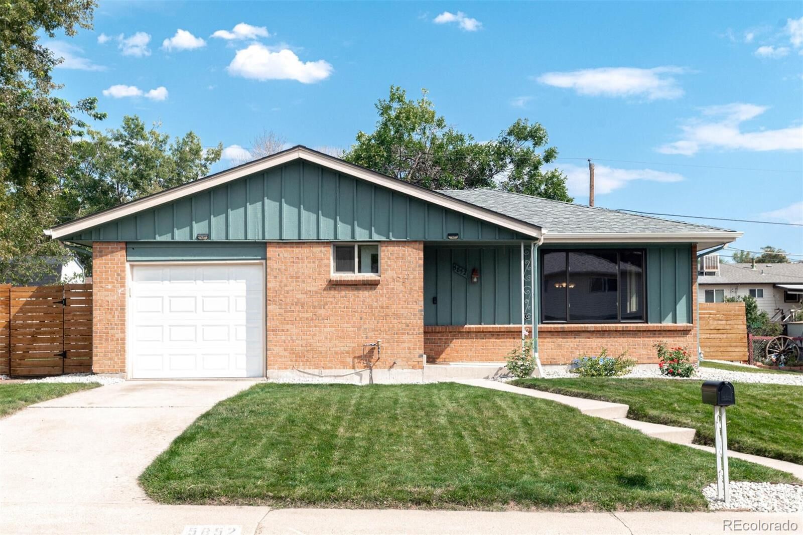 Property Photo:  5852 Owens Street  CO 80004 