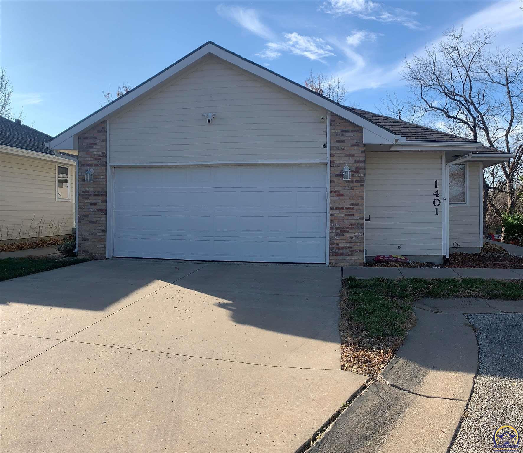 Property Photo: 1401 SW Woodhull Ct KS 66604