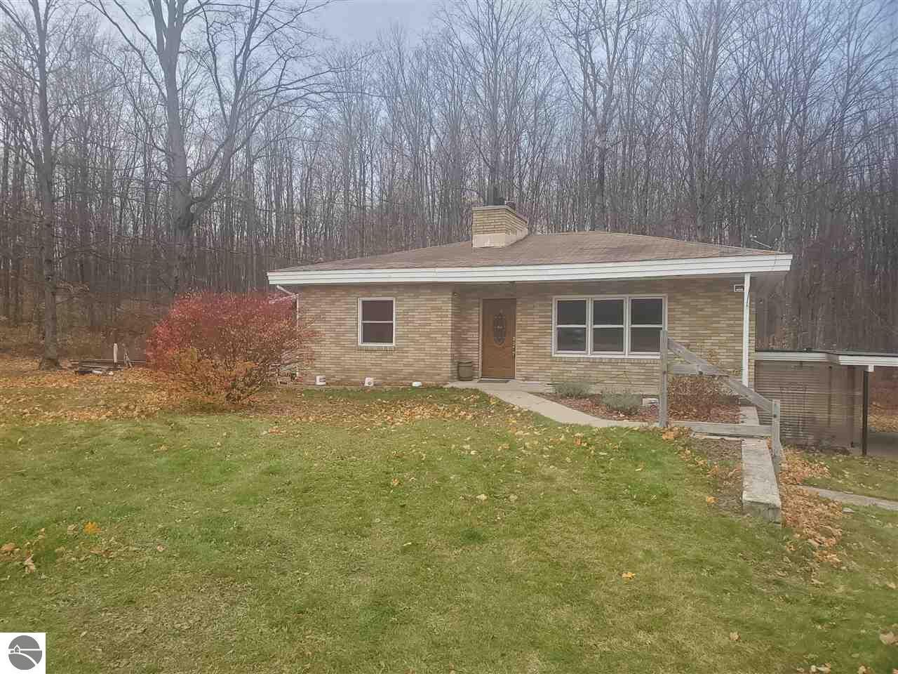 Property Photo:  7939 NE Co Road 571  MI 49659 