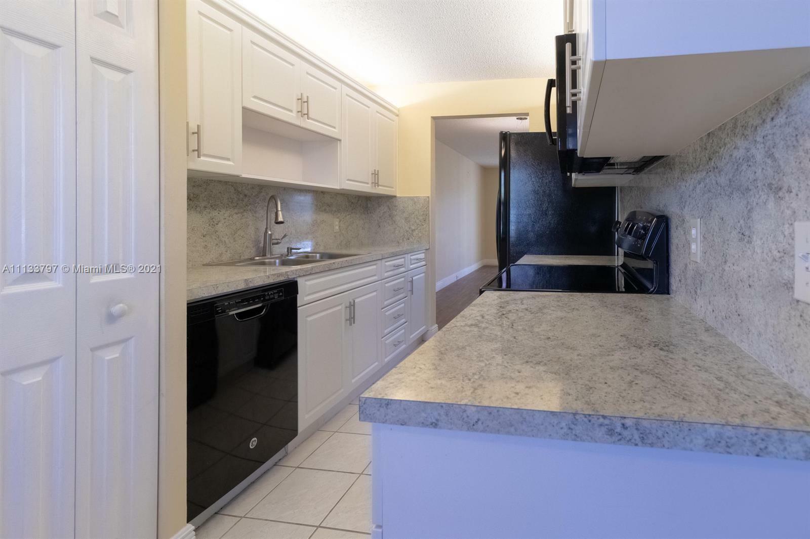 Property Photo:  13000 SW 15th Ct 105U  FL 33027 