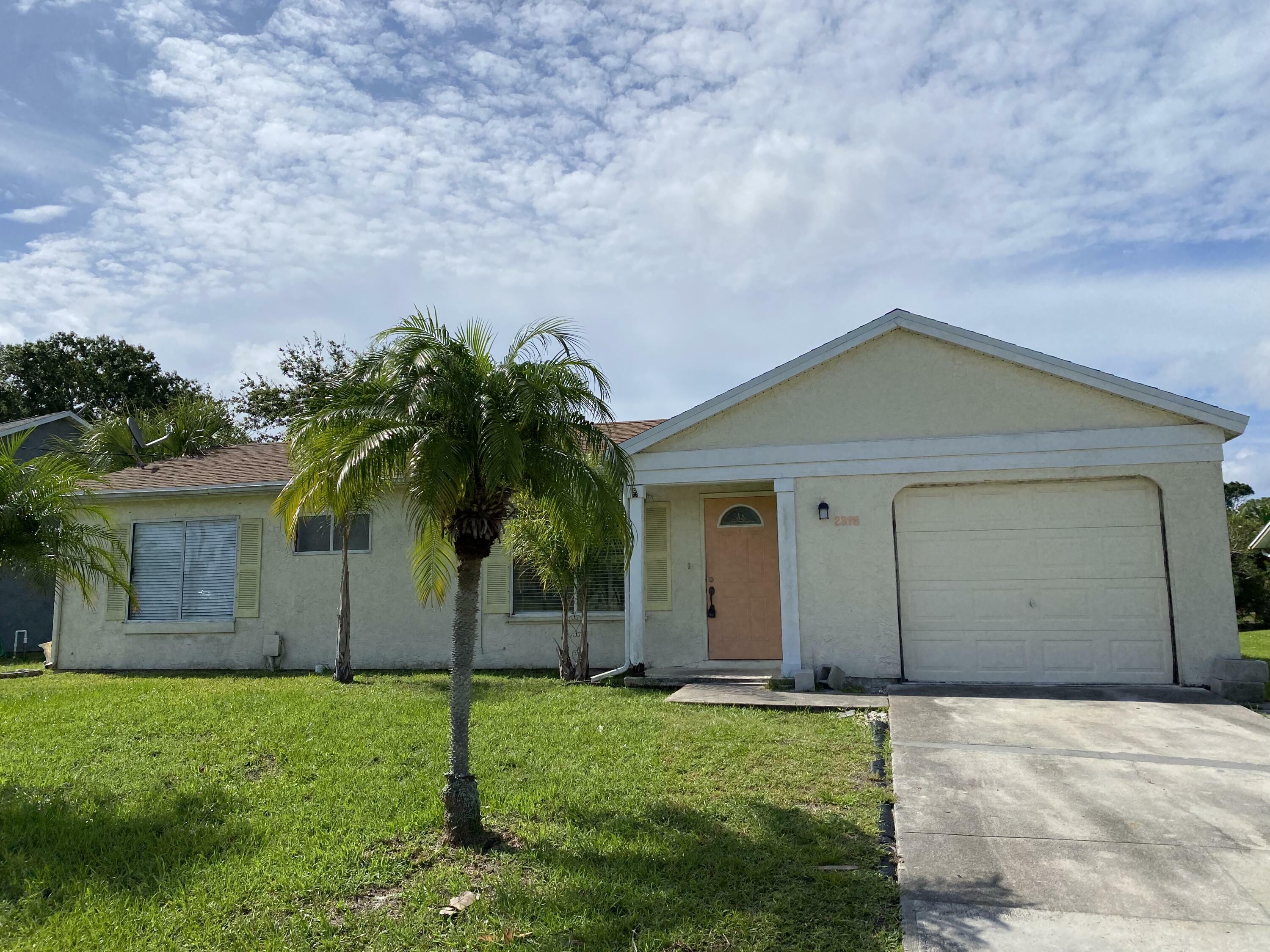 Property Photo:  2392 SE Maslan Avenue  FL 34952 