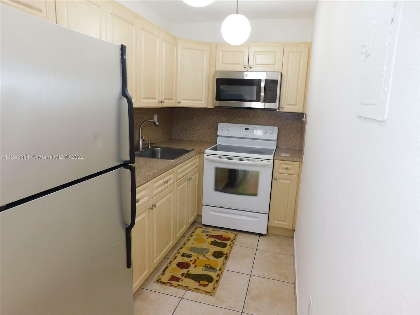 Property Photo:  4705 NW 7th St 405-7  FL 33126 