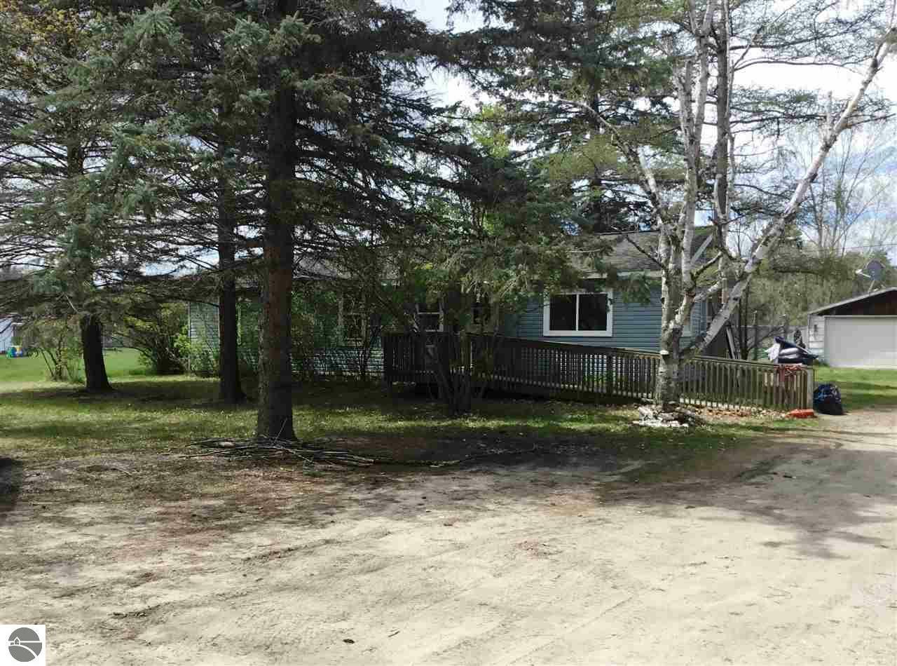 Property Photo:  8943 Rapid City Road NW  MI 49676 