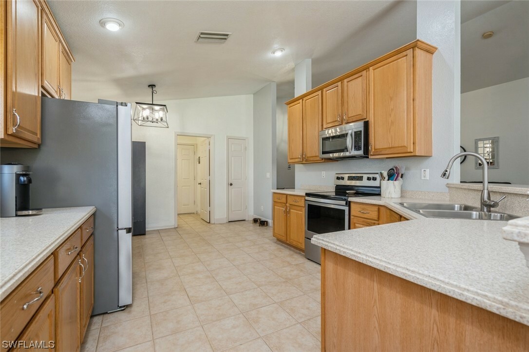 Property Photo:  9705 Gladiolus Bulb Loop  FL 33908 