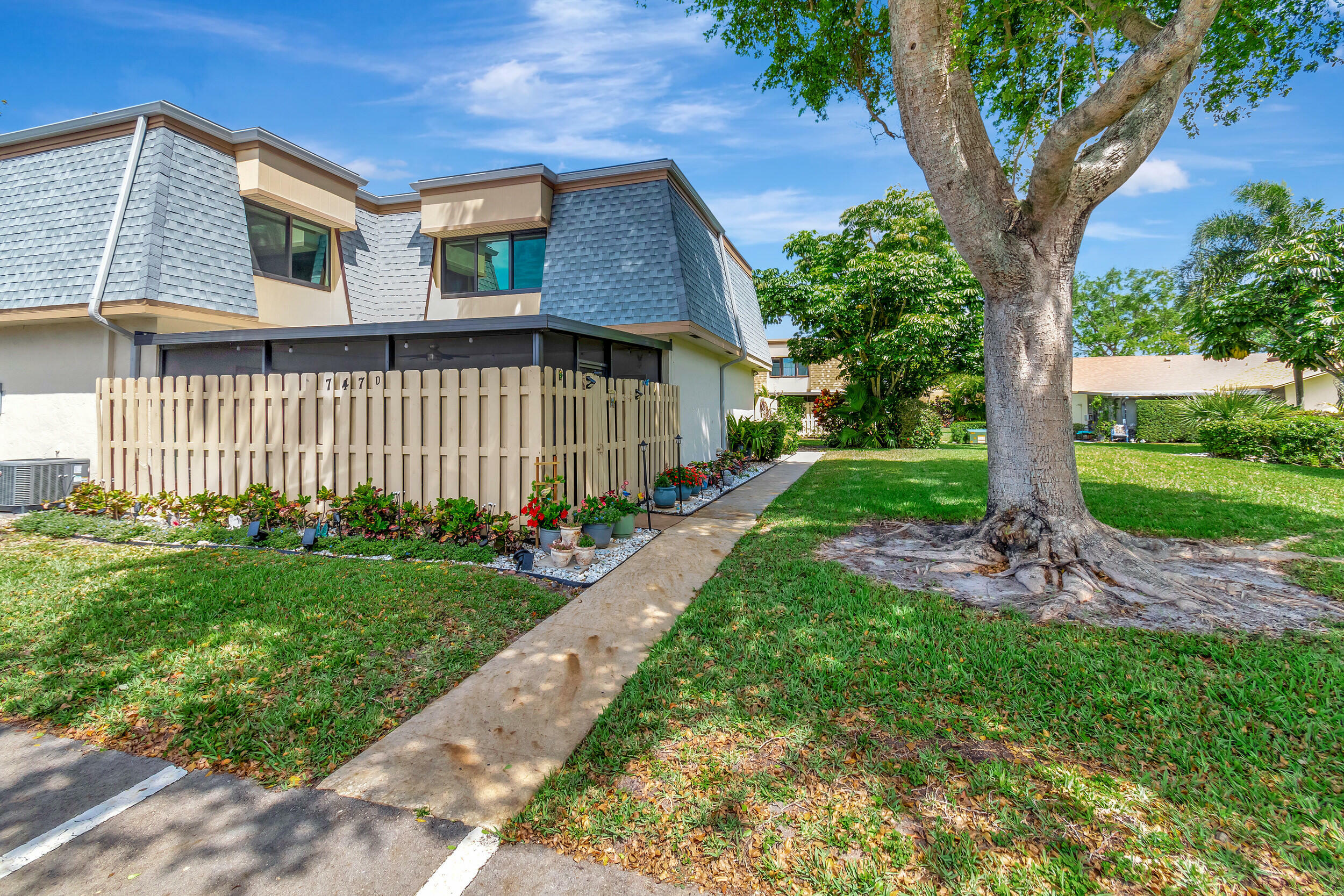 Property Photo:  747 NW 30th Avenue C  FL 33445 