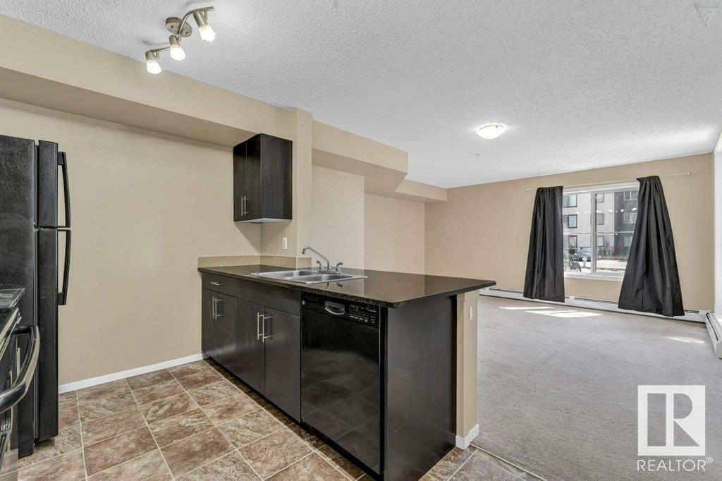 Property Photo:  5810 Mullen Place NW 120  AB T6R 0W3 