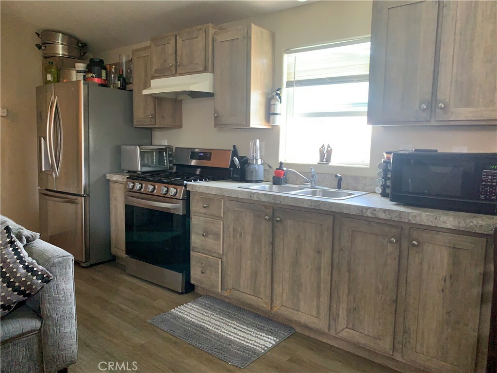 Property Photo:  12265 Woodruff Avenue 26  CA 90241 