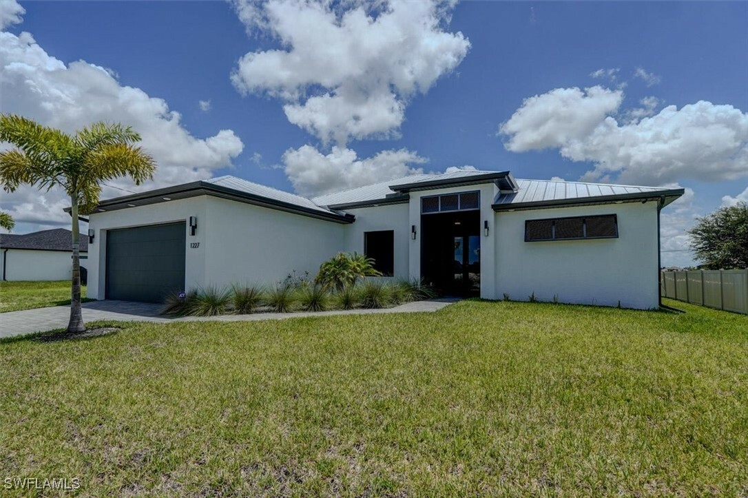 Property Photo:  1227 NW 40th Place  FL 33993 