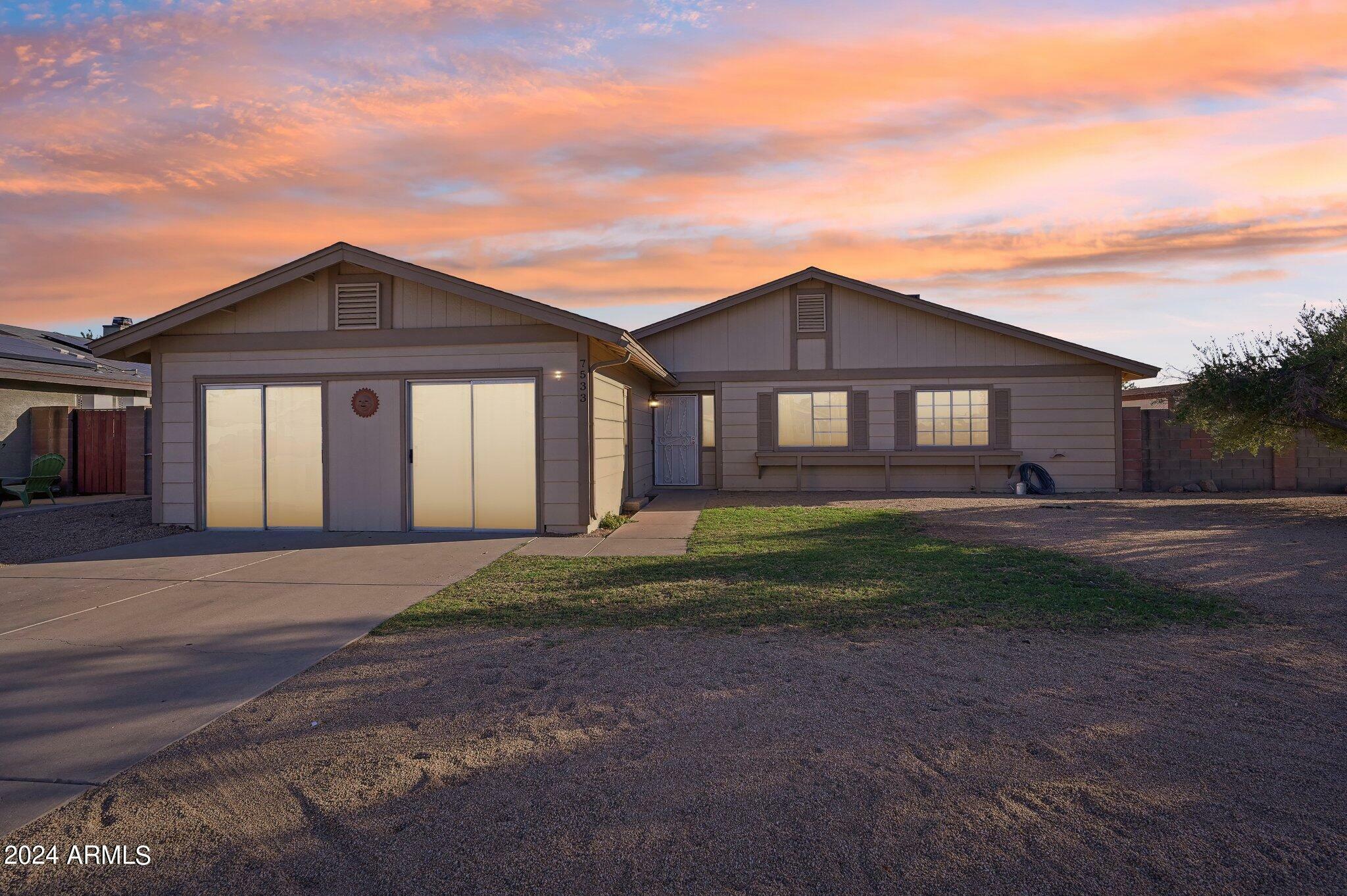 Property Photo:  7533 W Mercer Lane  AZ 85345 