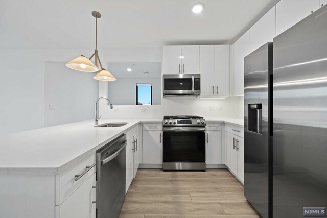 Property Photo:  115-117 W 2nd Street 301  NJ 07002 