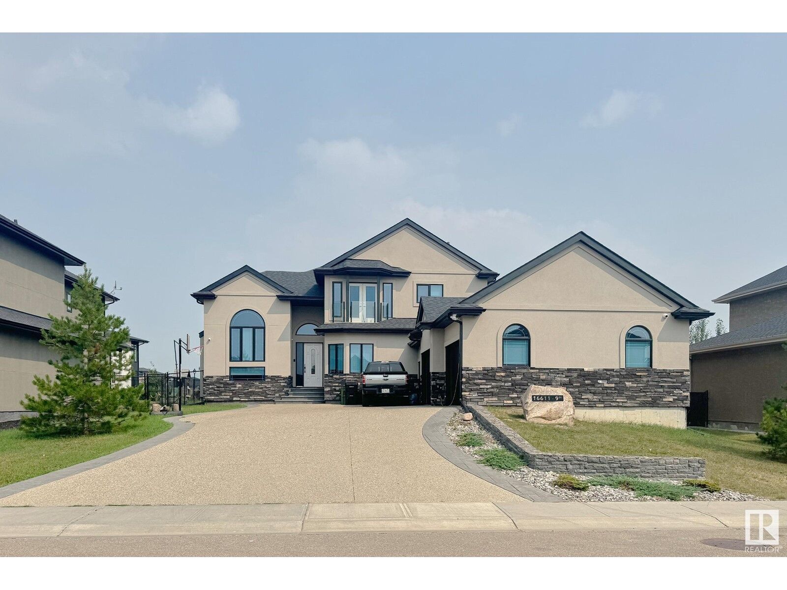 Property Photo: 16611 9 St NE AB T5Y 0P6
