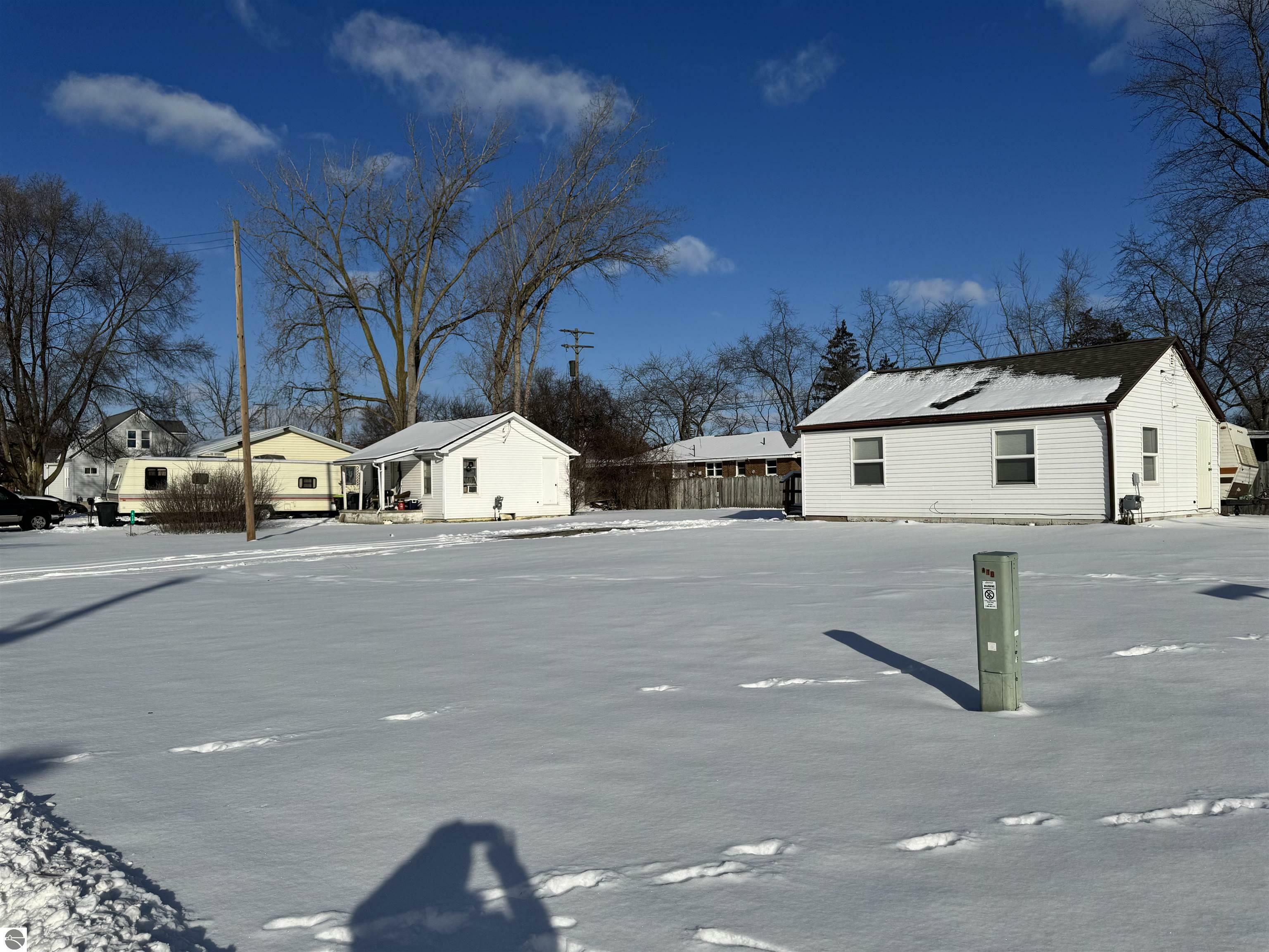 Property Photo:  410/412/414/416 Sam Street  MI 48642 