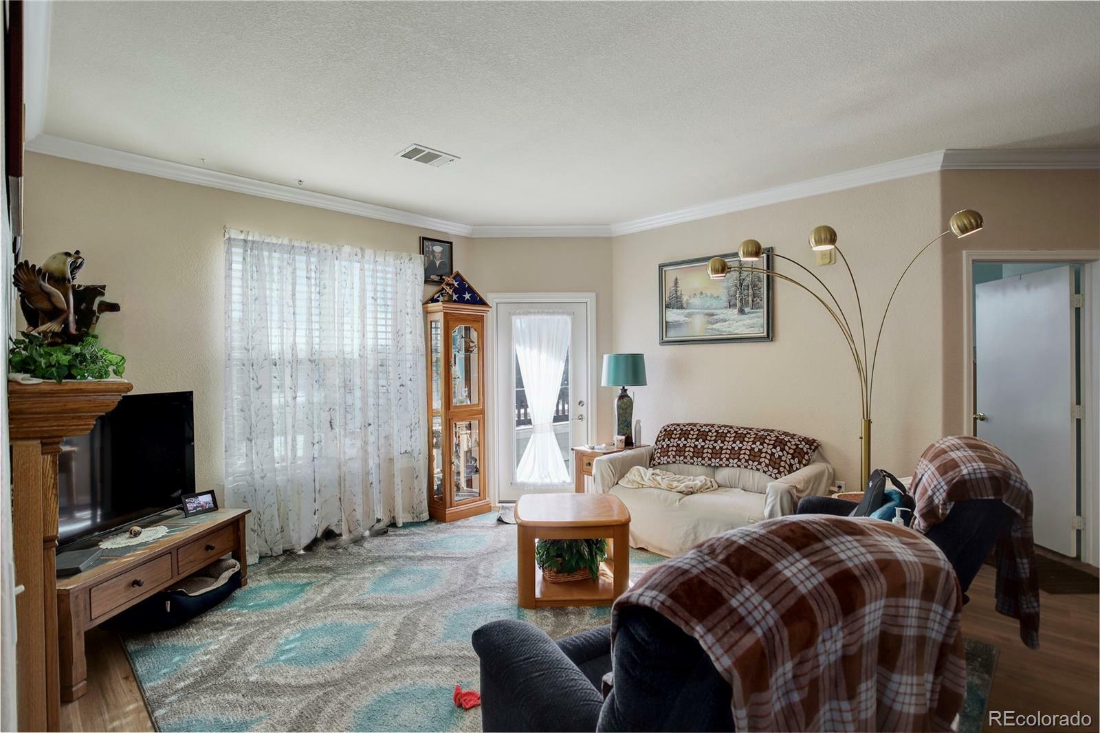 Property Photo: 19049 E Warren Drive 105 CO 80013
