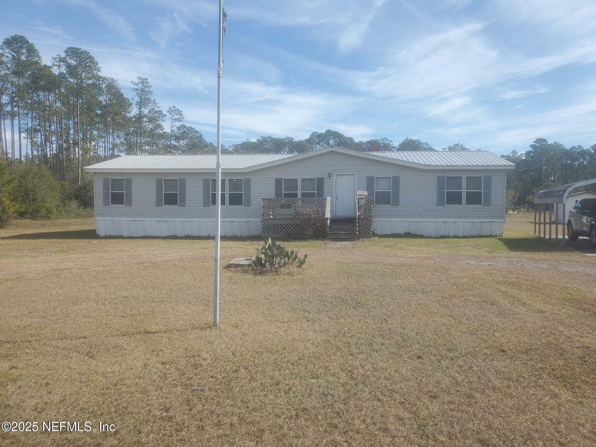 Property Photo:  100 Plantation Pines Drive  FL 32139 