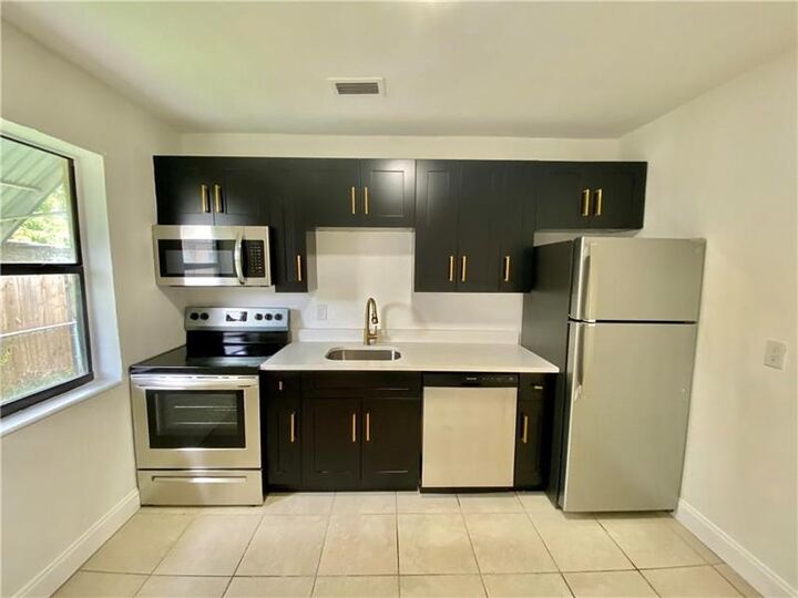Property Photo: 721 NW 1st Ct FL 33009