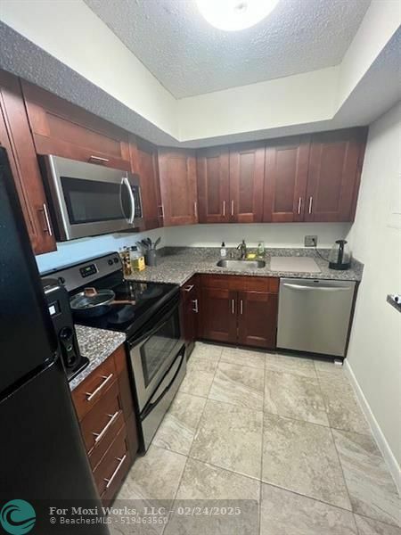 Property Photo:  5550 NW 44th St 212B  FL 33319 