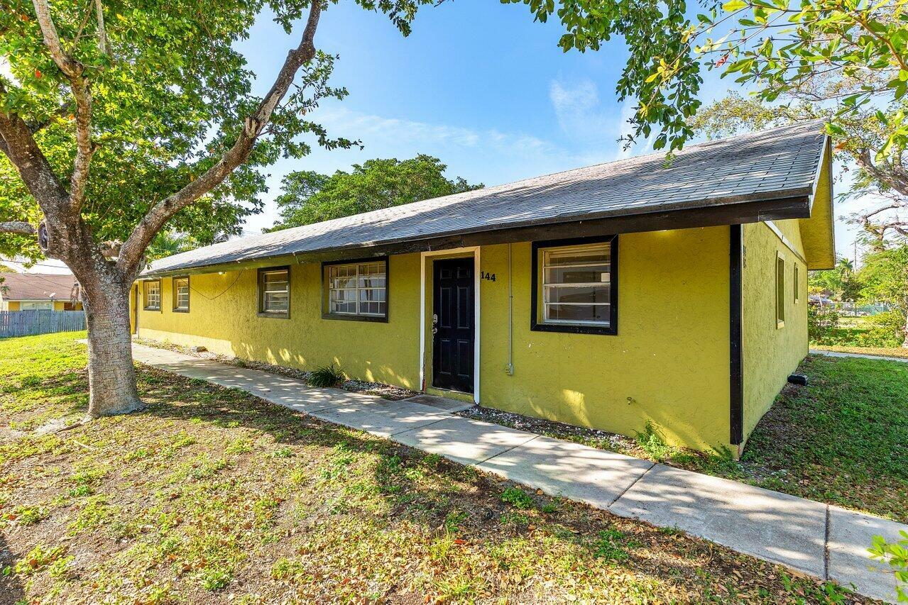 Property Photo:  144 SW 2nd Avenue  FL 33444 