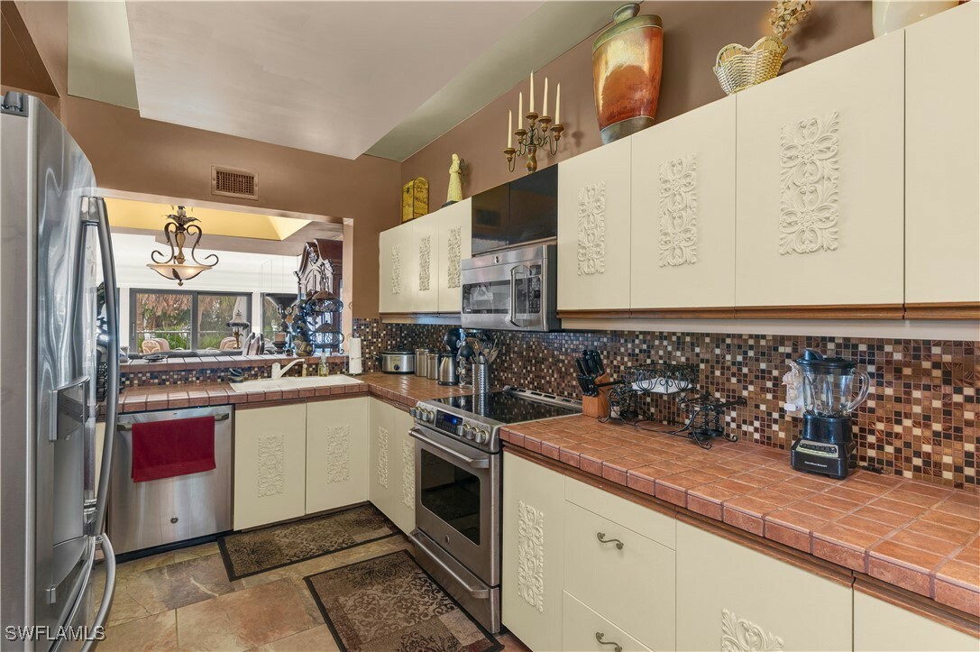 Property Photo: 103 La Peninsula Boulevard 103 FL 34113