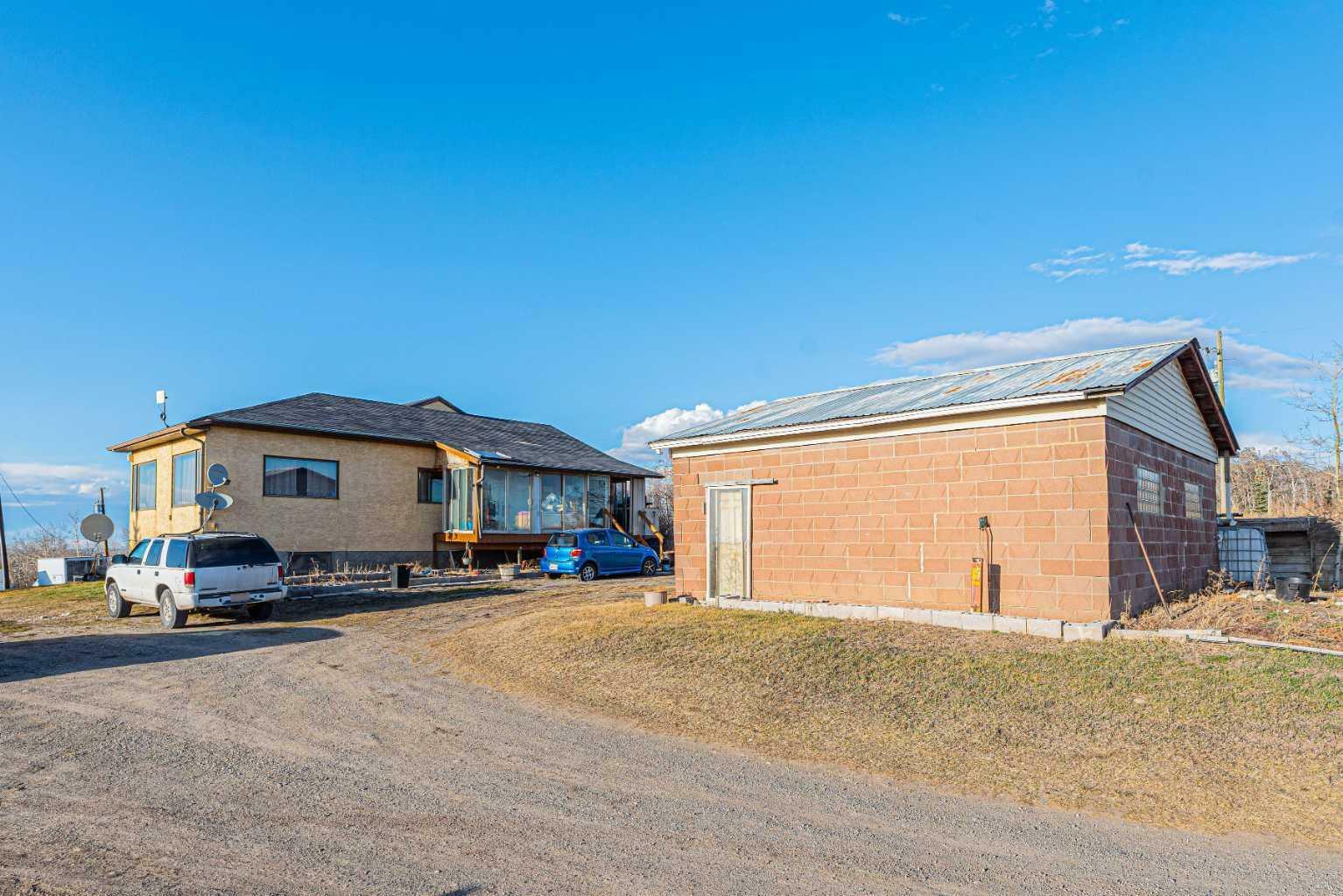 Property Photo: 266110 1014 Drive E AB T1S 4S5