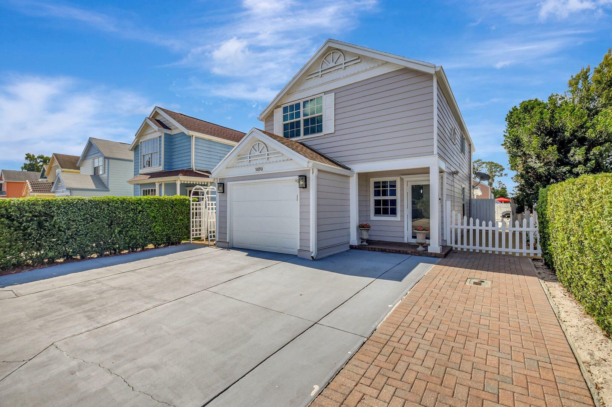 Property Photo: 5890 Rambler Rose Way FL 33415