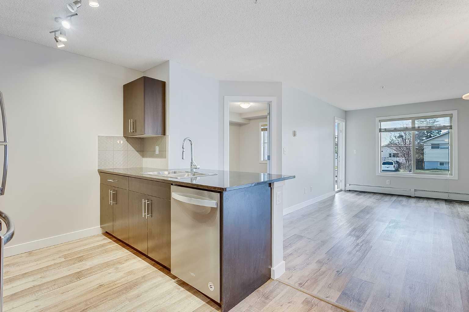 Property Photo:  1317 27 Street SE 4203  AB T2A 4Y5 