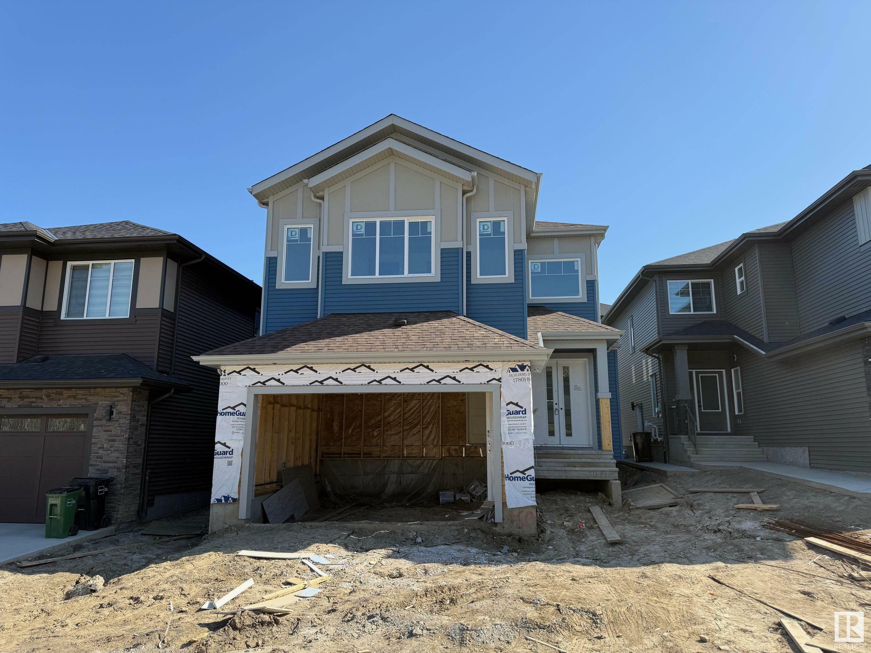 Property Photo: 1160 Gyrfalcon Crescent NW AB T5S 0S1