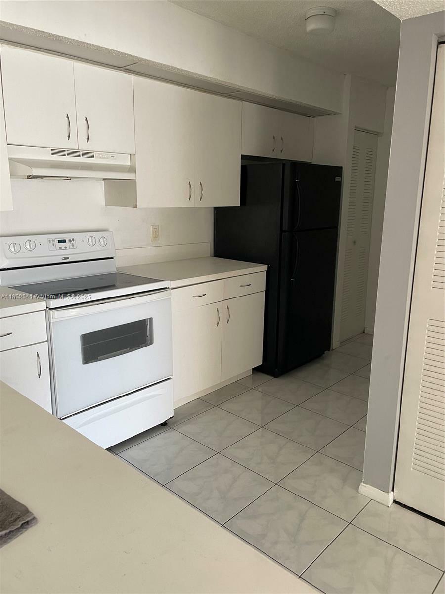 Property Photo: 18890 NW 57th Ave 305 FL 33015