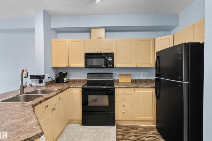 Property Photo: 4304 139 Avenue NW 225 AB T5Y 0H6