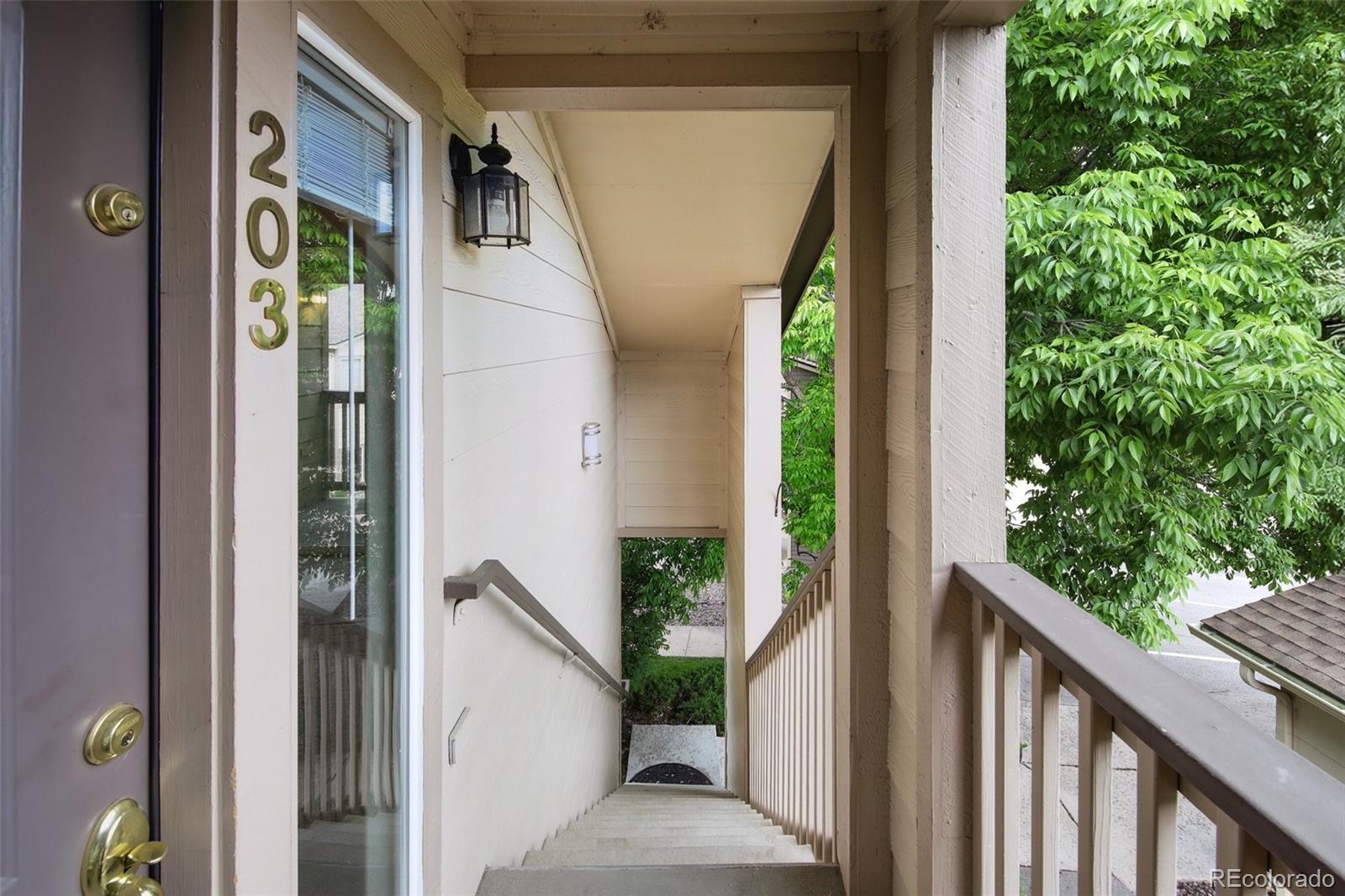 Property Photo: 8775 W Berry Avenue 203 CO 80123