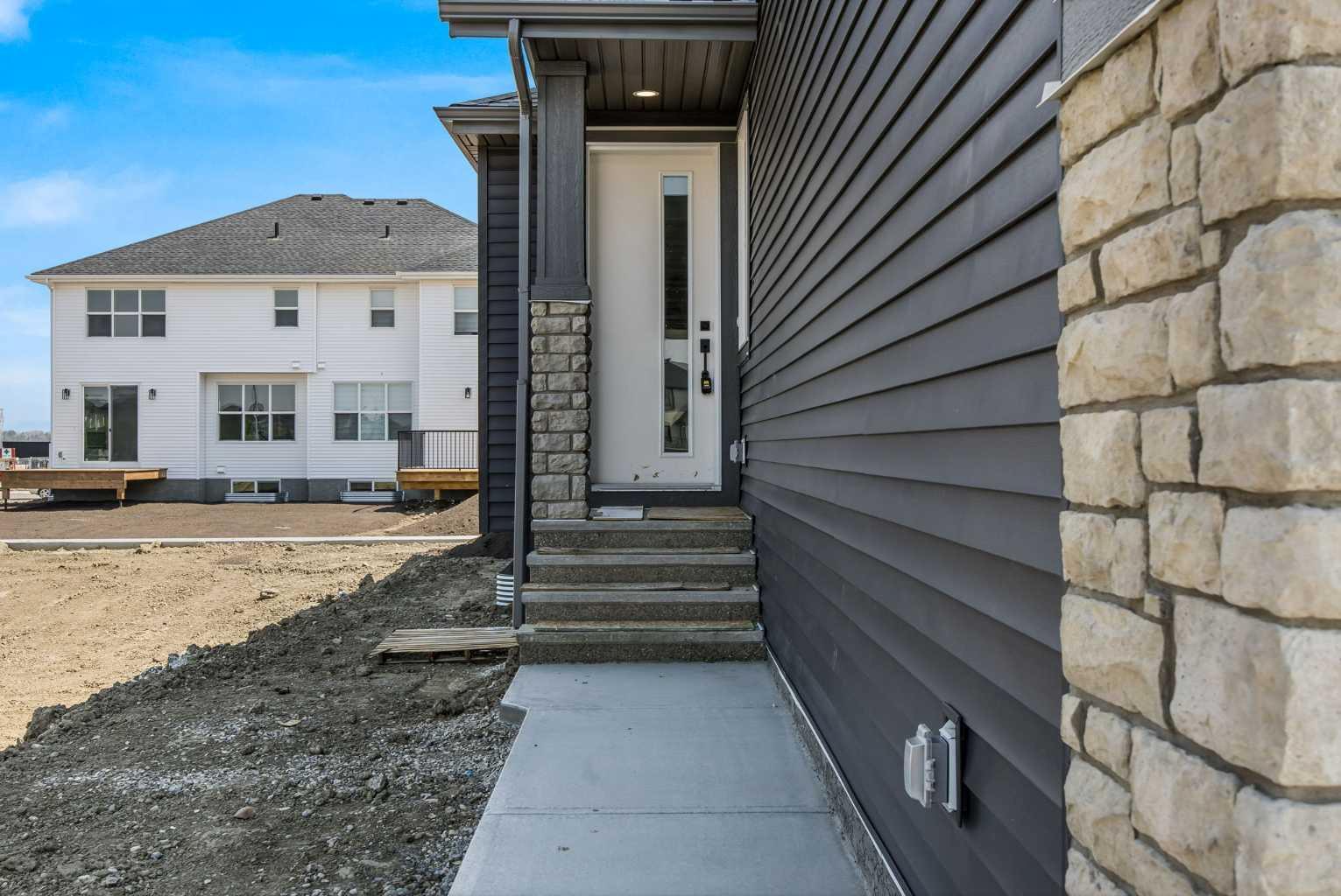 Property Photo:  271 Kinniburgh Loop  AB T1X 3C2 