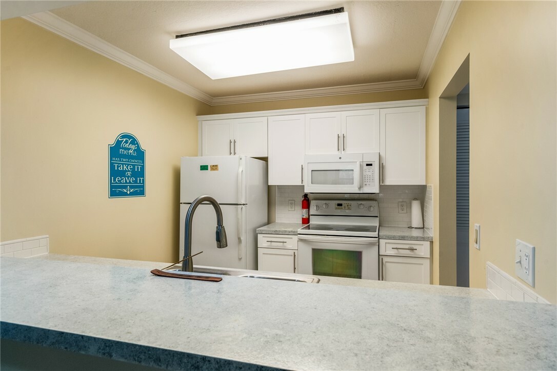 Property Photo: 6 Plantation Drive 203 FL 32966