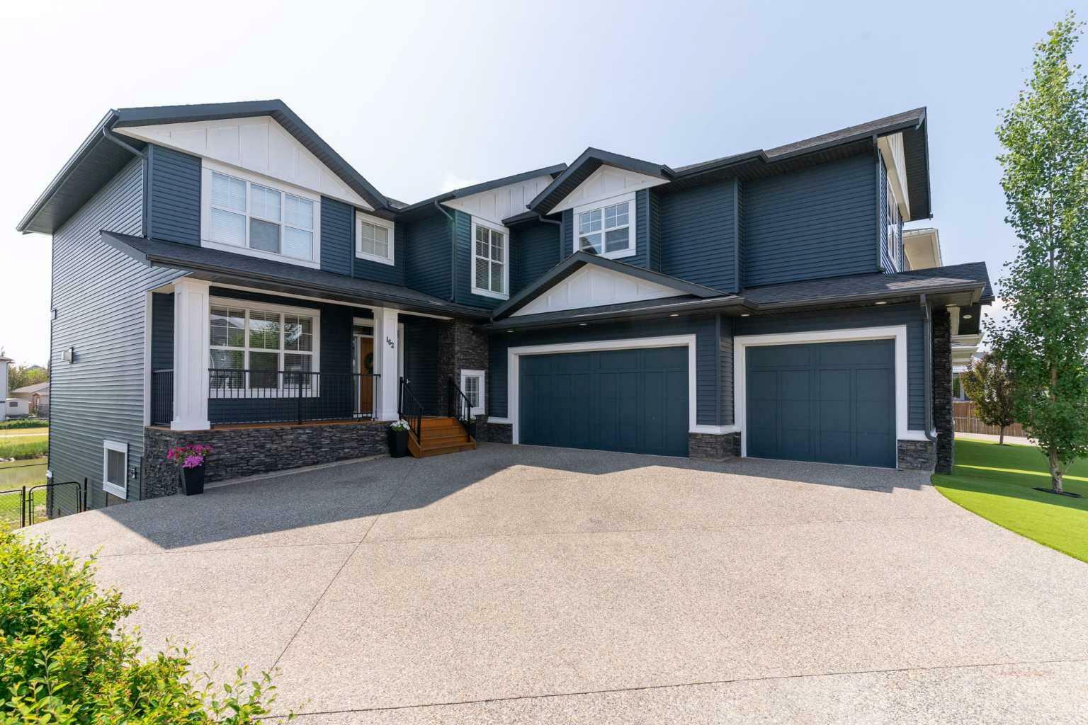 Property Photo: 162 Canoe Crescent SW AB T4B 2N9