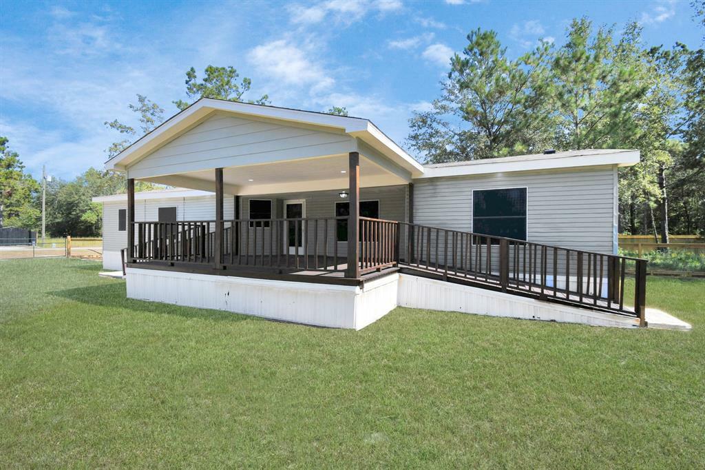 Property Photo: 422 County Road 3414 TX 77327