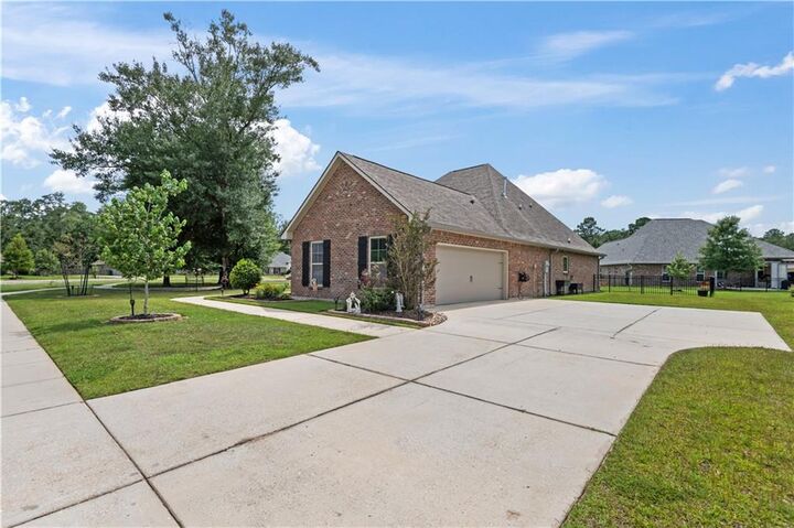 Property Photo:  318 Saw Grass Loop  LA 70435 