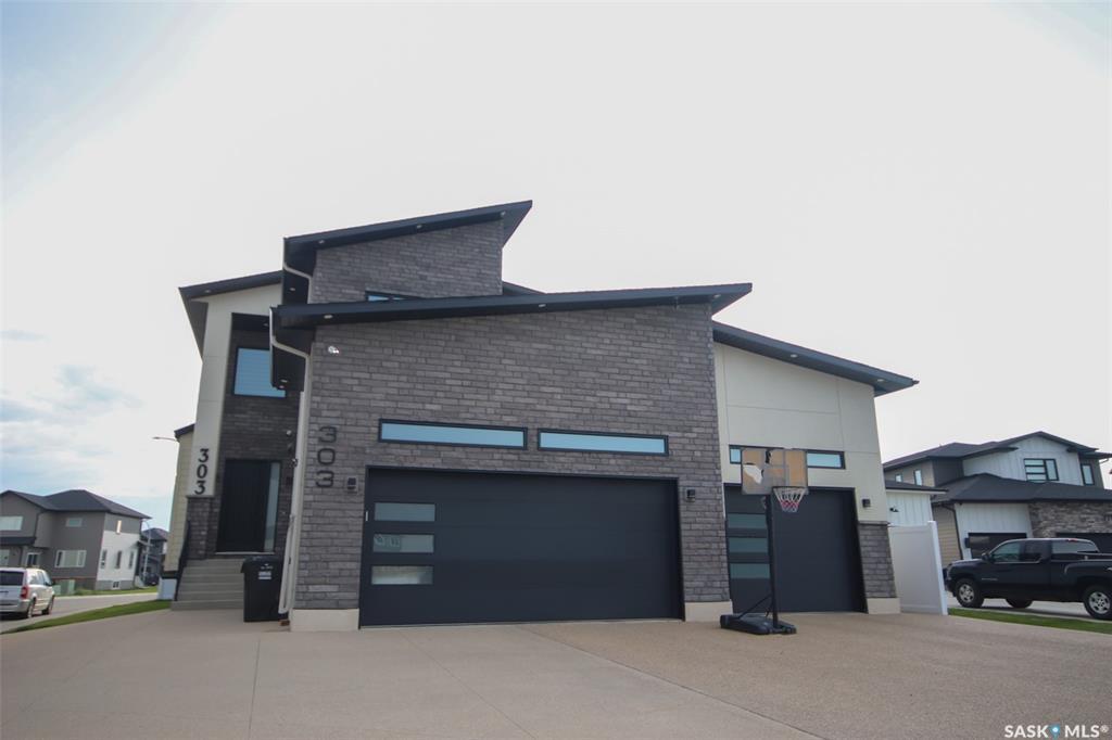 Property Photo: 303 Woolf Bay SK S7W 1E5