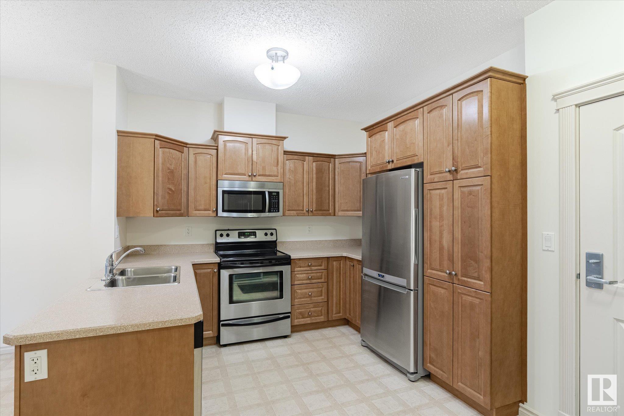 Property Photo:  9820 165 Street NW 111  AB T5P 0N3 