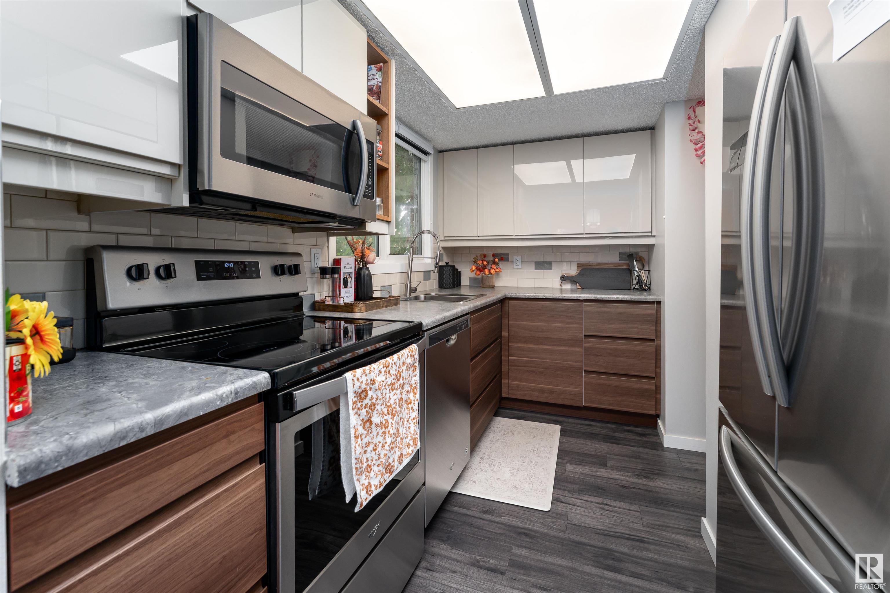 Property Photo:  13841 24 Street NW  AB T5Y 1K1 
