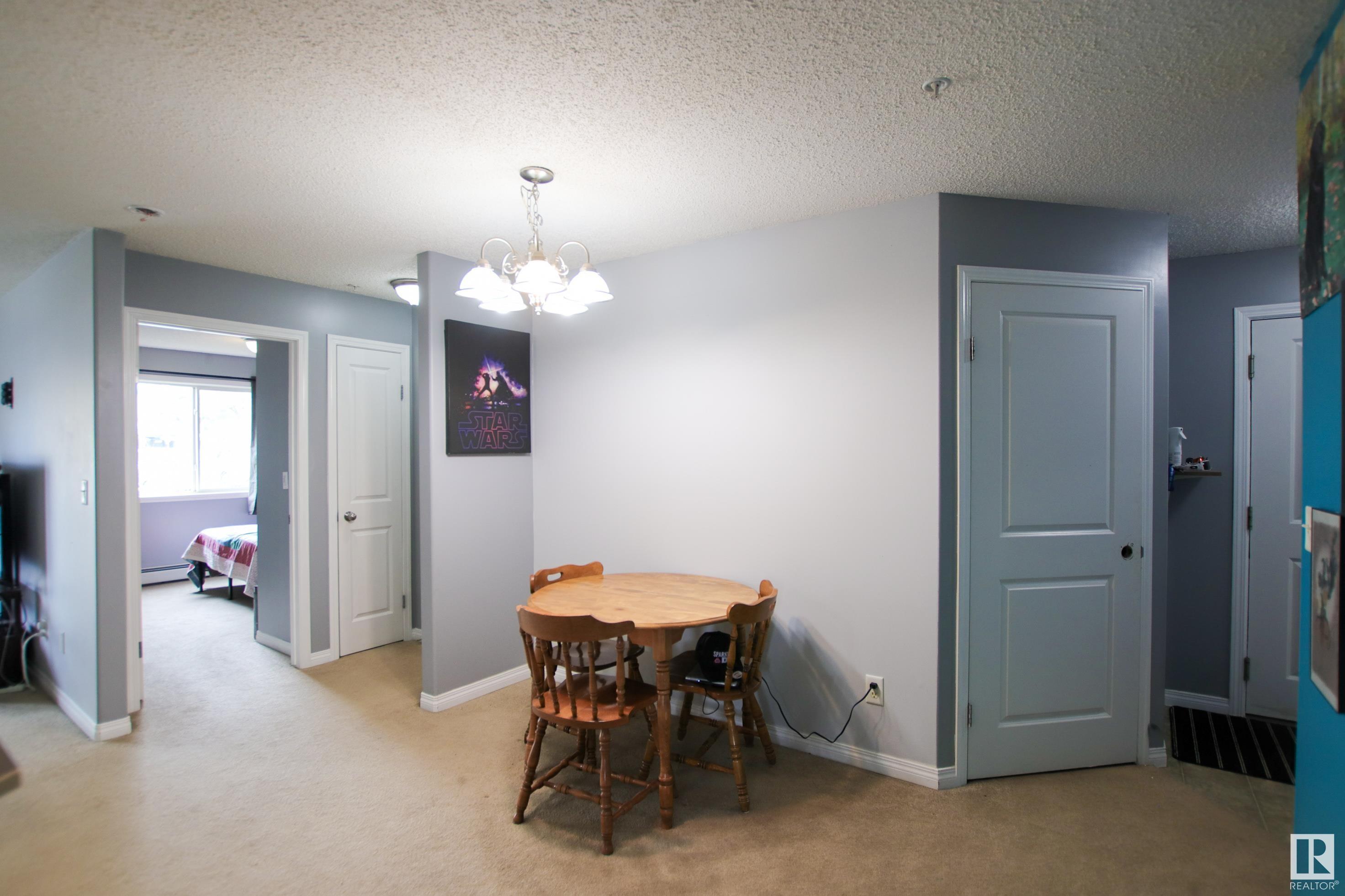 Property Photo:  14708 50 Street NW 103  AB T5A 5G9 