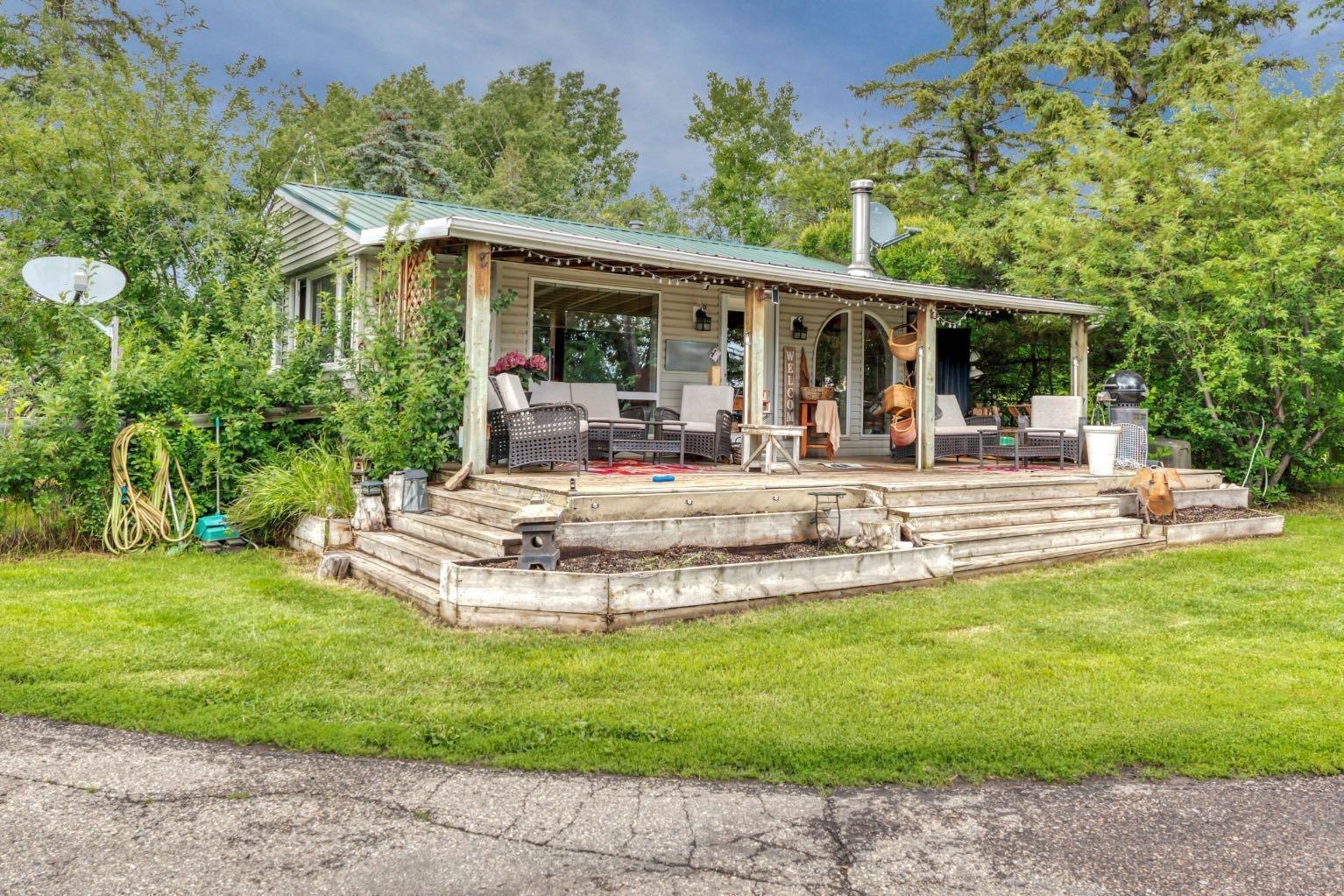 Property Photo: 338067 1067 Drive E 10 AB T1S 4T2