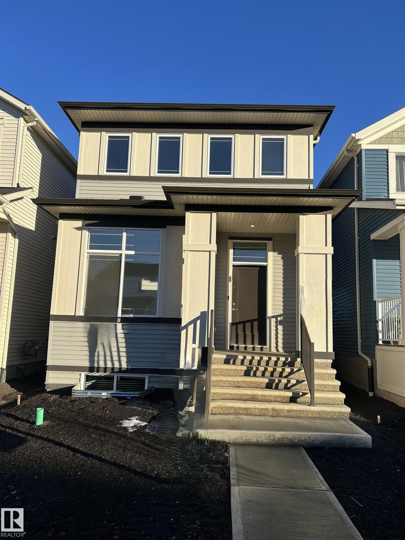 Property Photo:  5115 Parc Reunis Way  AB T4X 3E6 