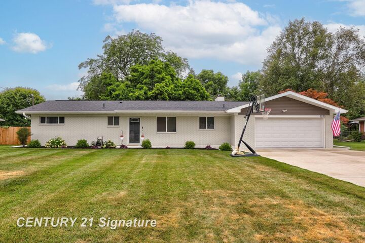 Property Photo:  6235 Dewhirst Drive  MI 48638 