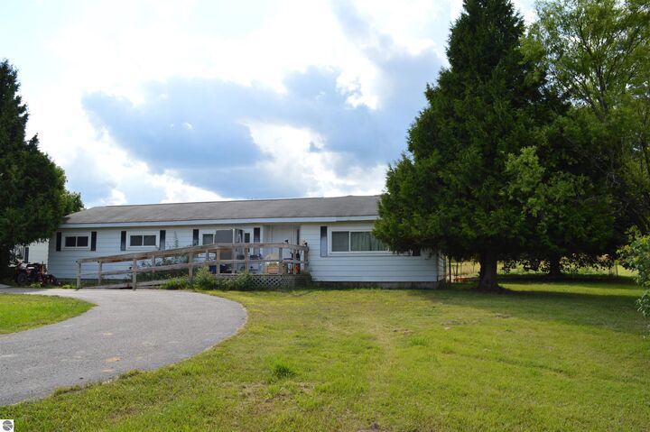 Property Photo:  1167 NE Rosenberg Road  MI 49646 