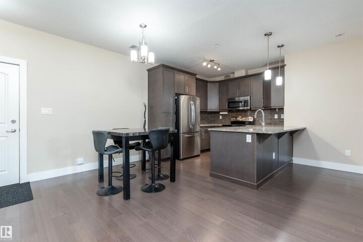 Property Photo: 6079 Maynard Way NW 140 AB T6R 0S4