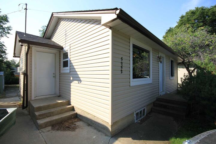 Property Photo: 5052 44 Avenue AB T1G 1S7