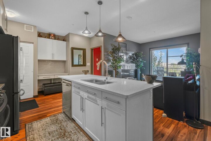 Property Photo: 1144 Adamson Drive SW 404 AB T6W 2X7