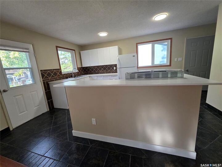 Property Photo:  1200 Dahl Street E  SK S9H 3Z3 