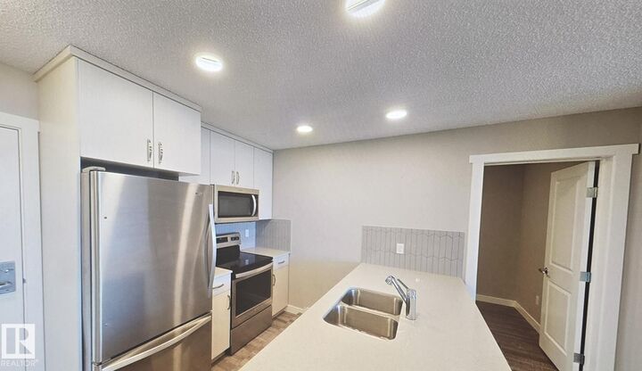 Property Photo:  1506 Tamarack Boulevard NW 409  AB T6T 2E3 